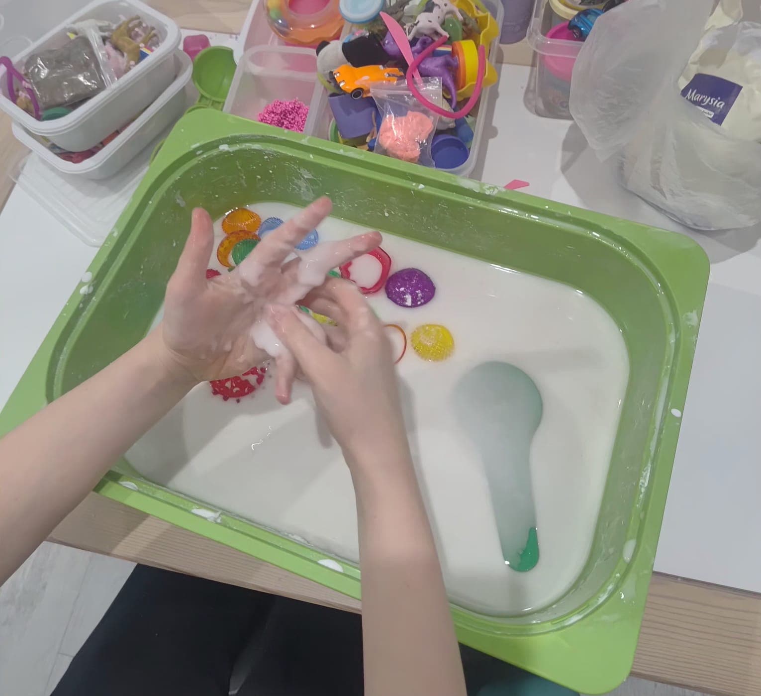 A child works on a fine motor task during therapy.