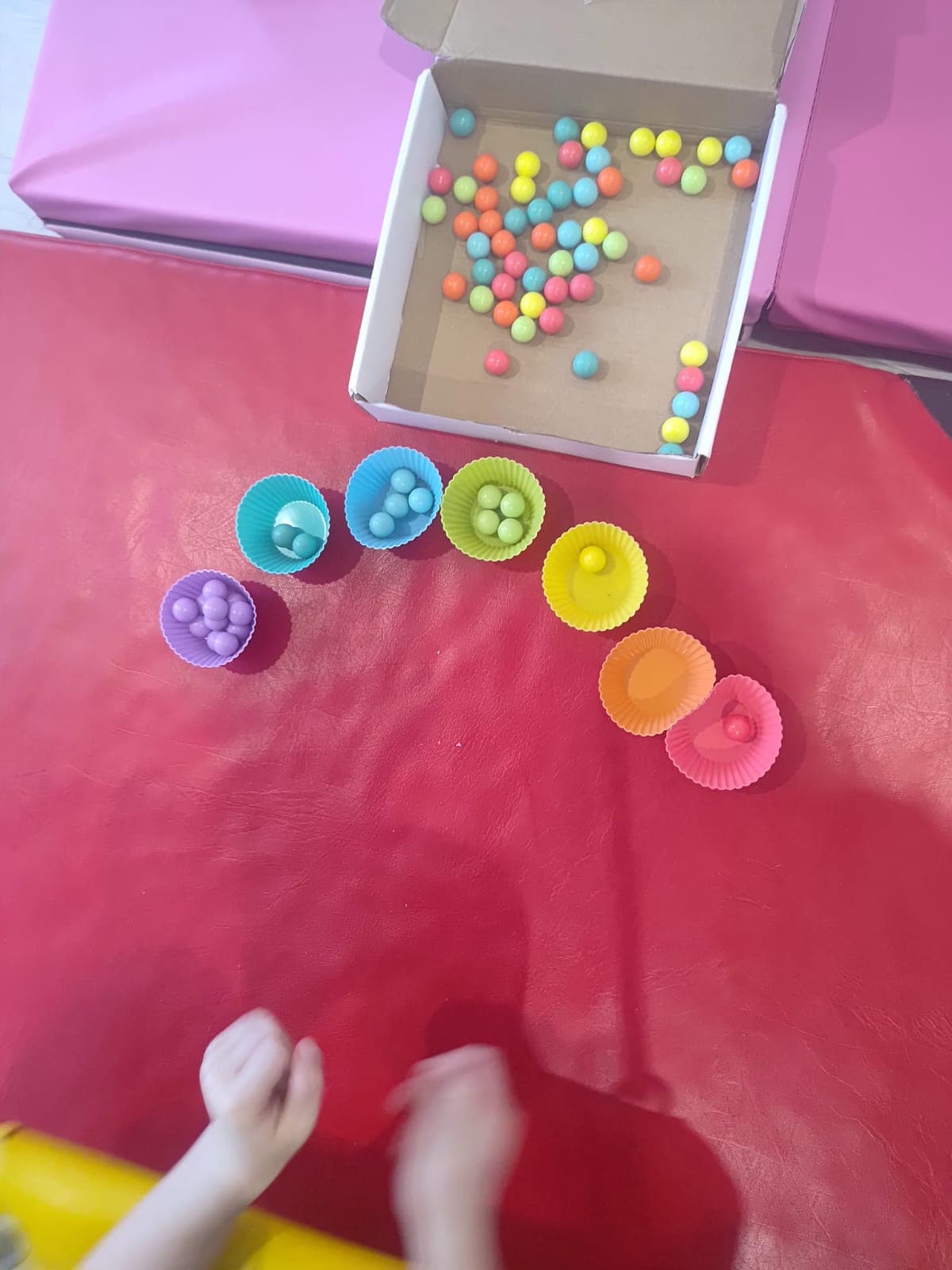 A child works on a fine motor task during therapy.