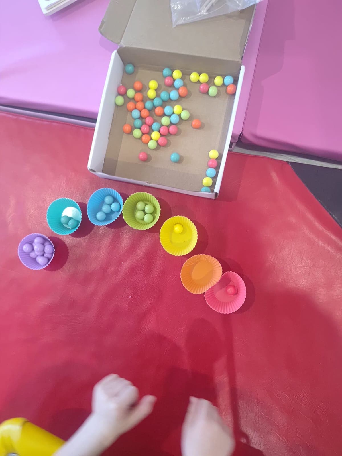 A child works on a fine motor task during therapy.
